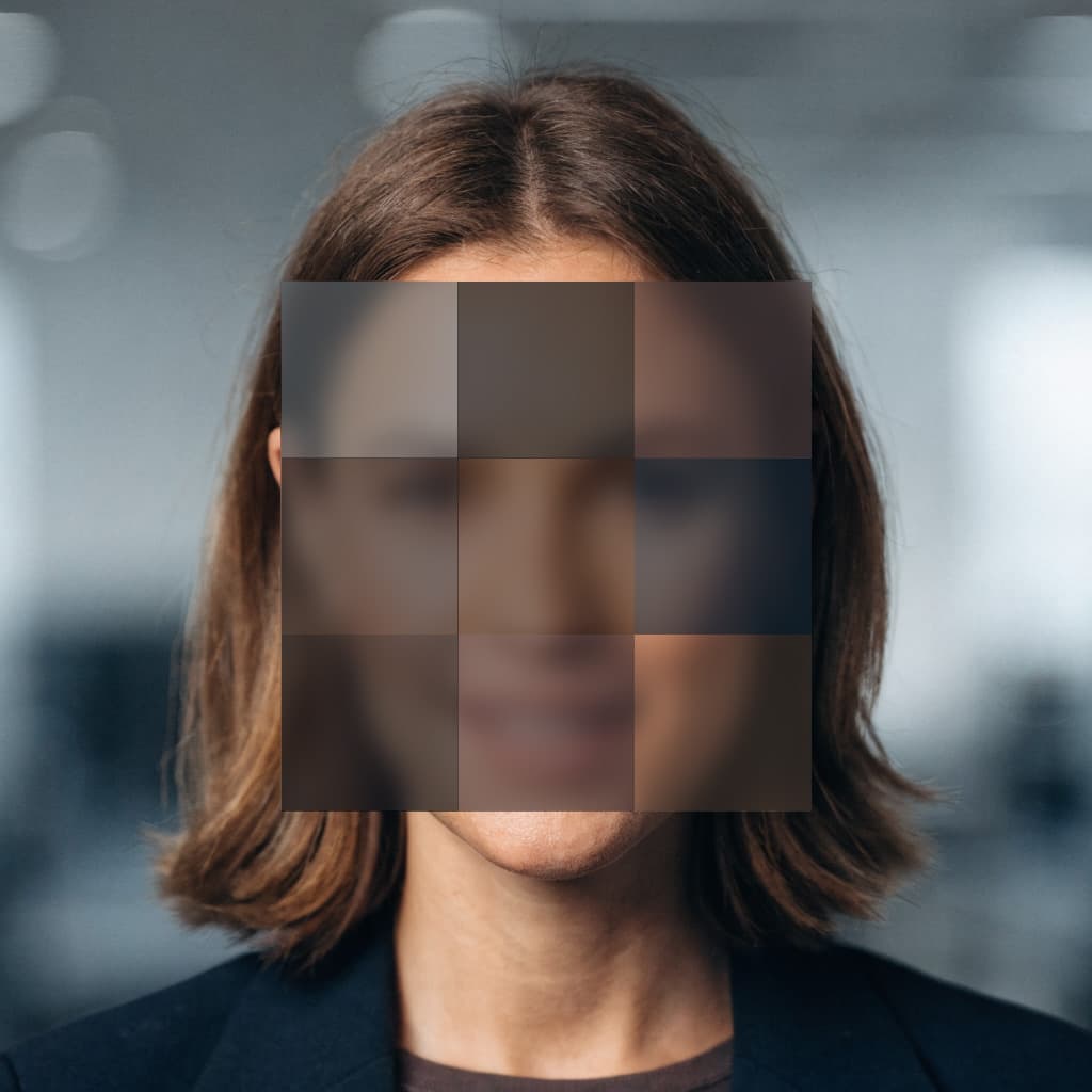 An office worker's profile photo with the face obscured by pixelation blocks